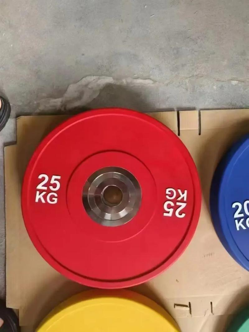 举重杠铃片是什么材质